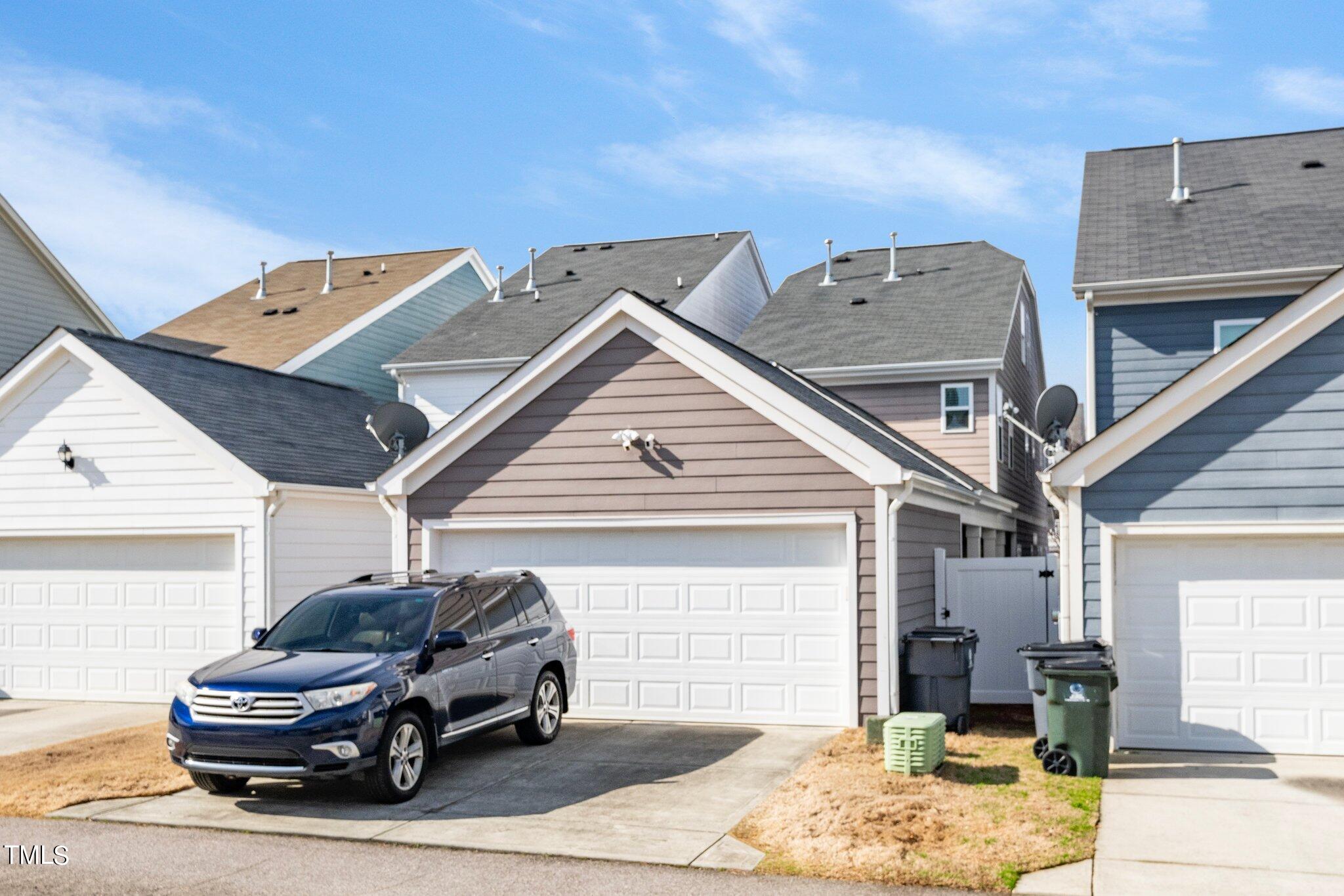 903 Ambergate Station Apex, NC 27502 - Photo 23 of 24 a car parked in front of house