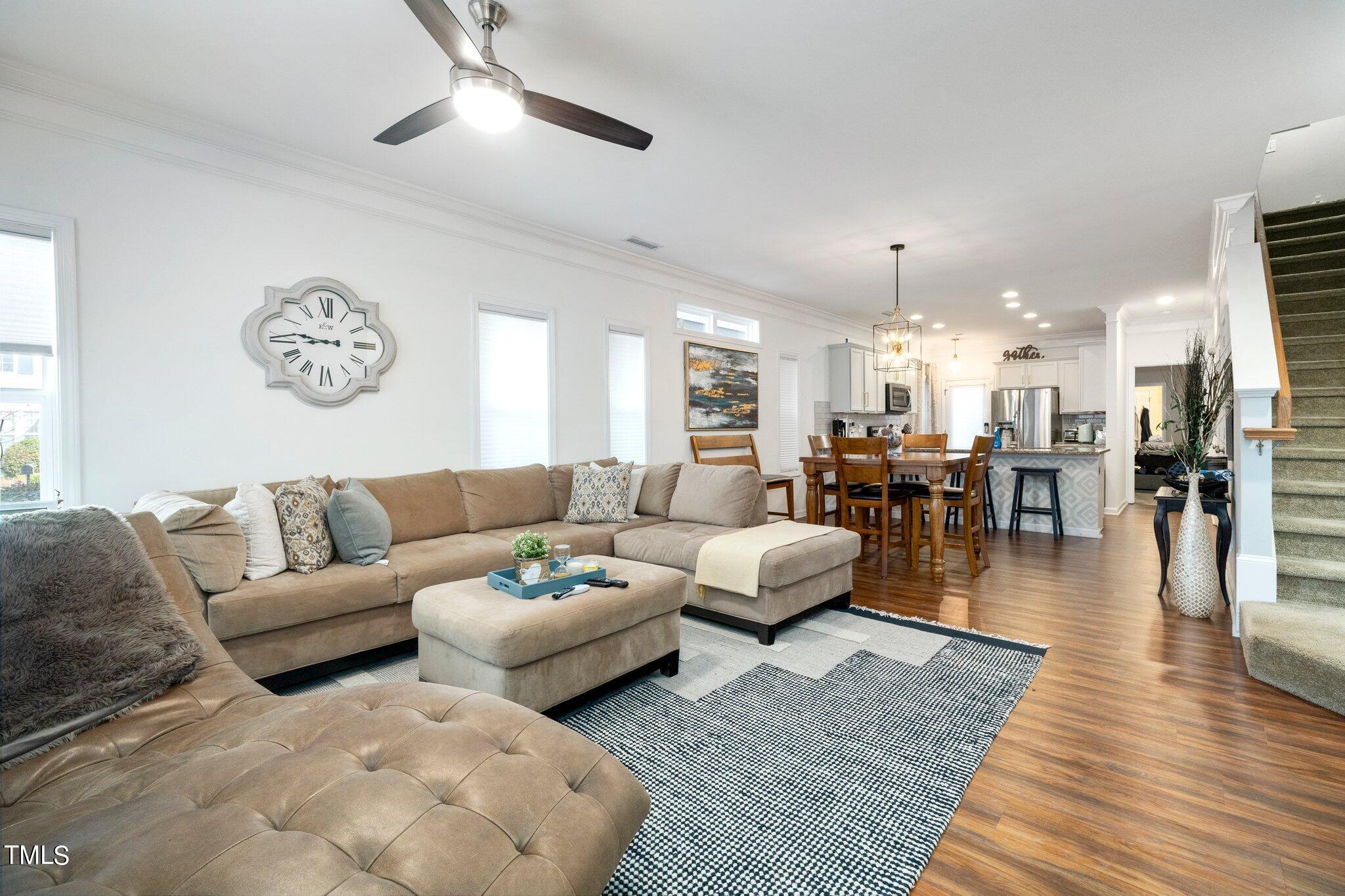 903 Ambergate Station Apex, NC 27502 - Photo 5 of 24 a living room with furniture and wooden floor