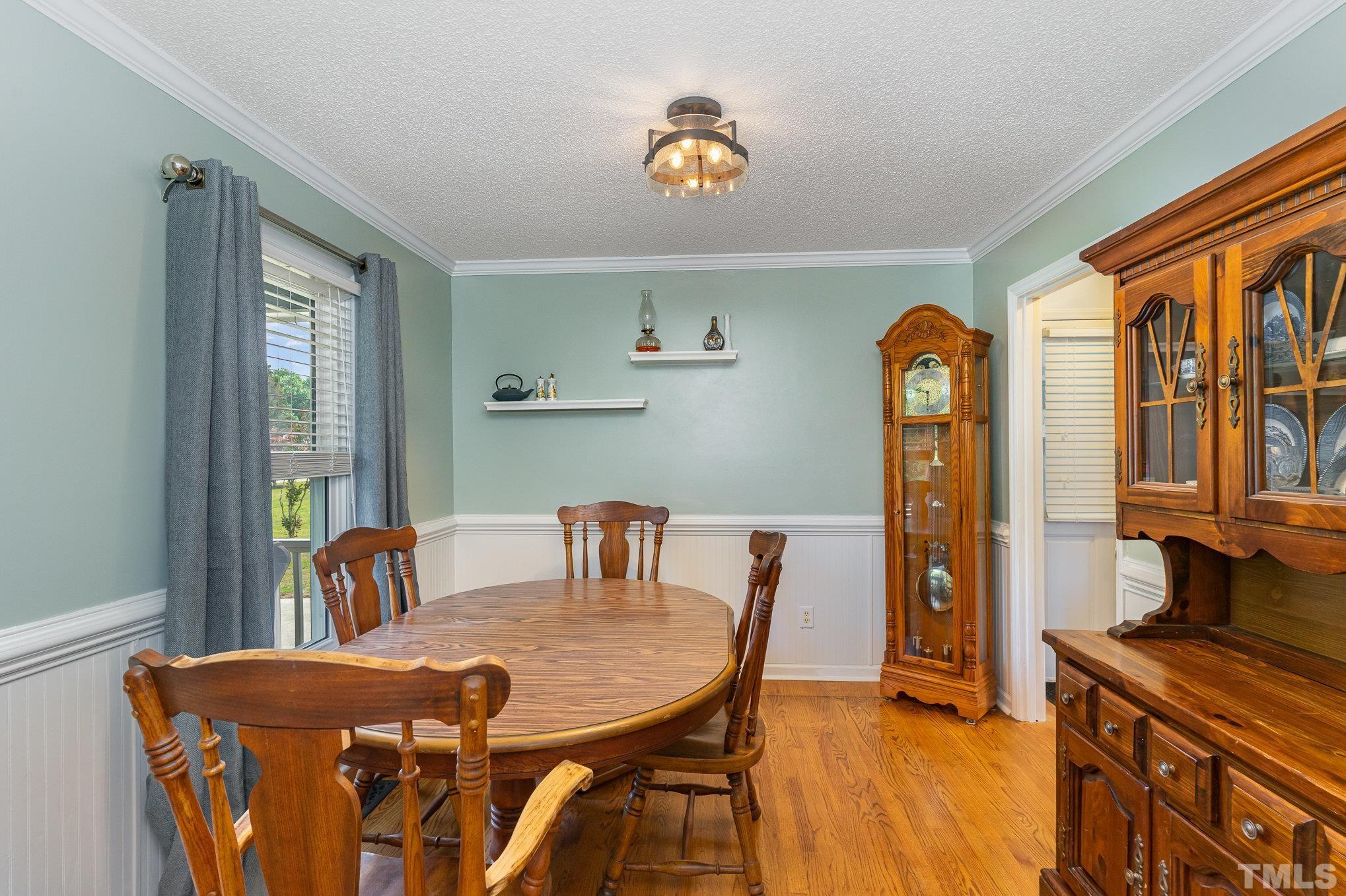 616 Jordan Ridge Lane Raleigh, NC 27603 - Photo 13 of 31 a view of a dining room with furniture and a chandelier