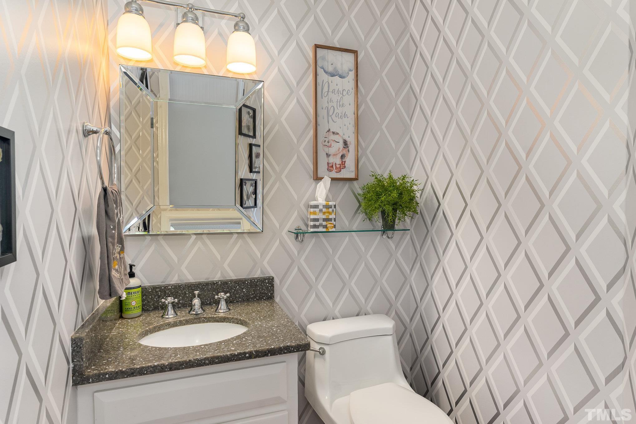 616 Jordan Ridge Lane Raleigh, NC 27603 - Photo 15 of 31 a bathroom with a granite countertop sink and a mirror with toilet