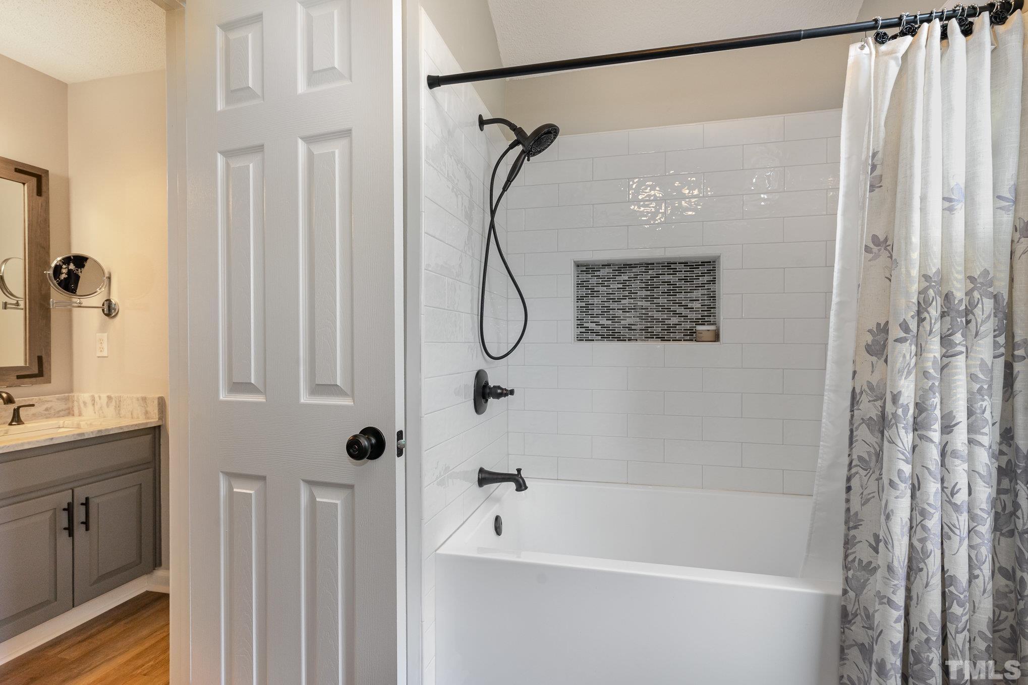 616 Jordan Ridge Lane Raleigh, NC 27603 - Photo 19 of 31 a bathroom with a bath tub with a shower