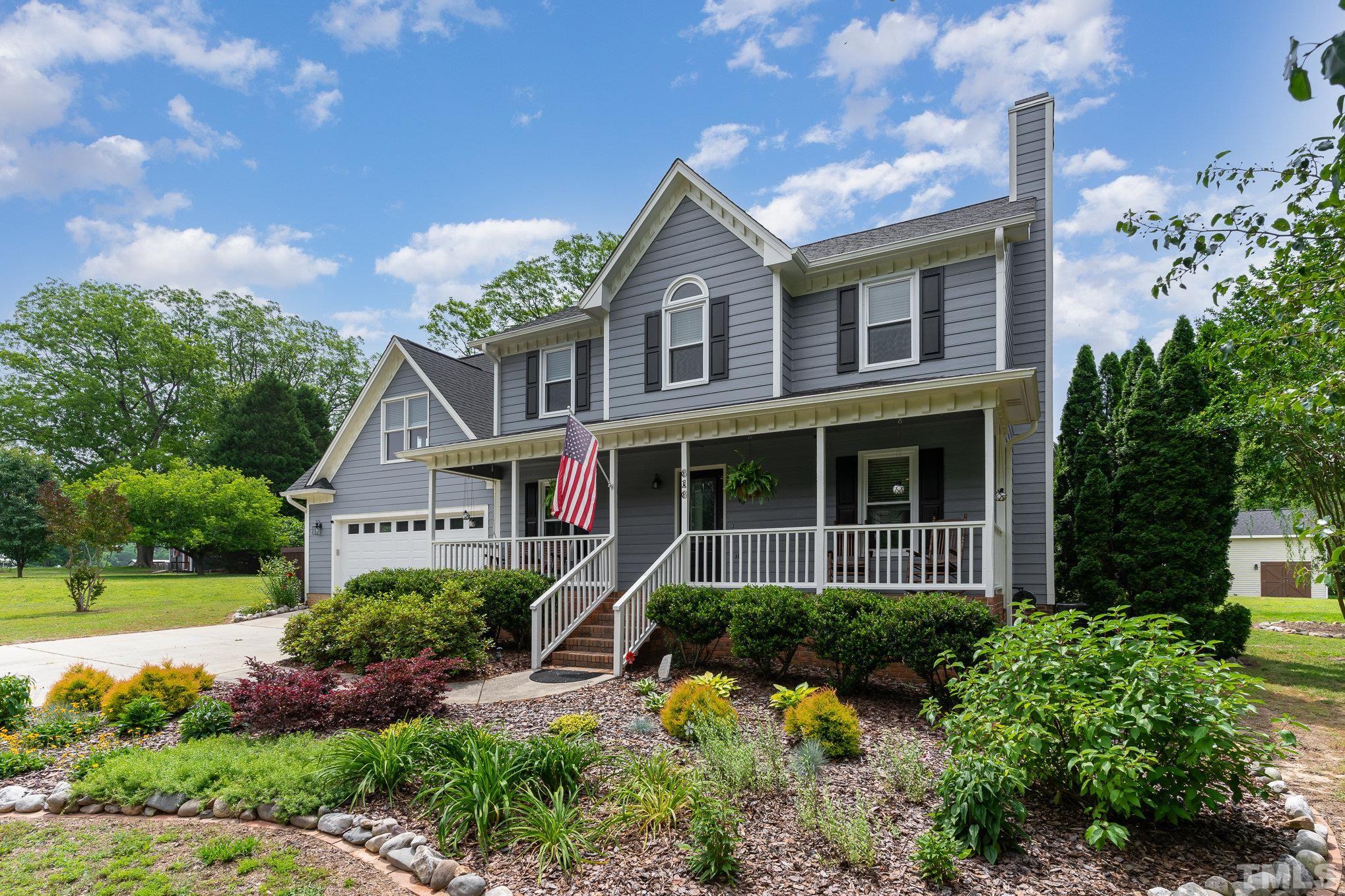 616 Jordan Ridge Lane Raleigh, NC 27603 - Photo 2 of 31 a front view of a house with a yard