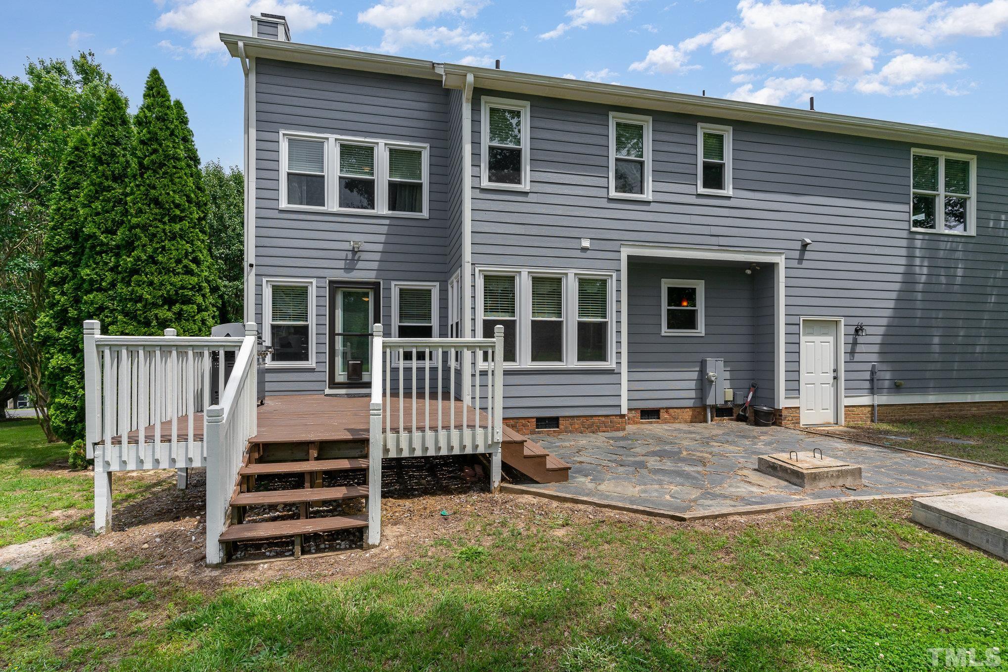 616 Jordan Ridge Lane Raleigh, NC 27603 - Photo 28 of 31 a view of a house with backyard and wooden fence