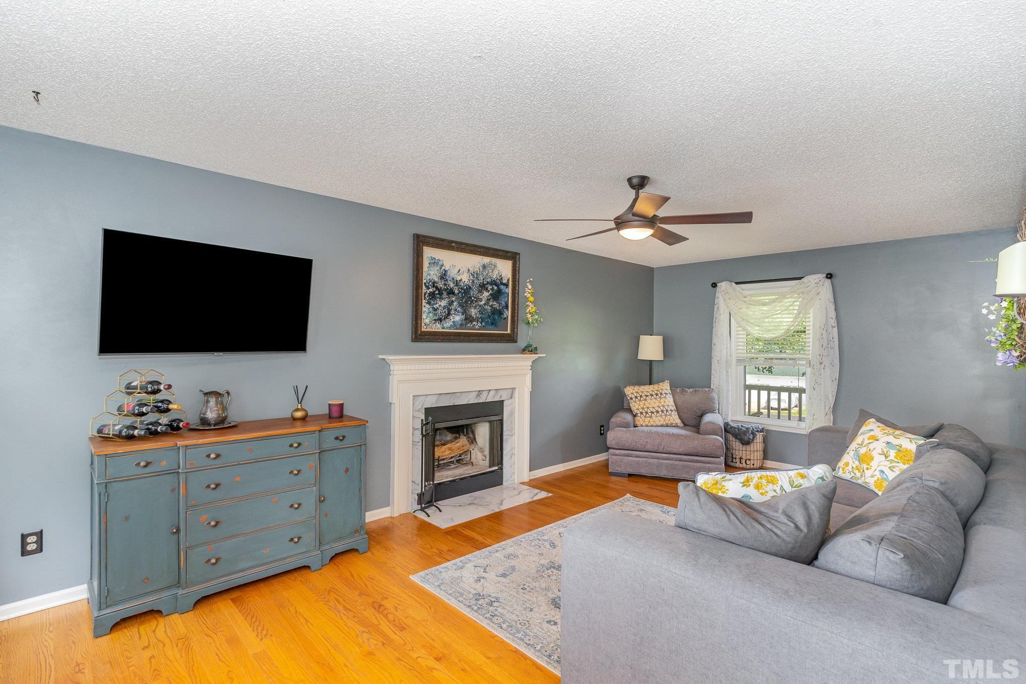 616 Jordan Ridge Lane Raleigh, NC 27603 - Photo 10 of 31 a living room with furniture and a flat screen tv
