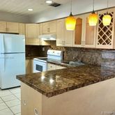 a kitchen with refrigerator and window