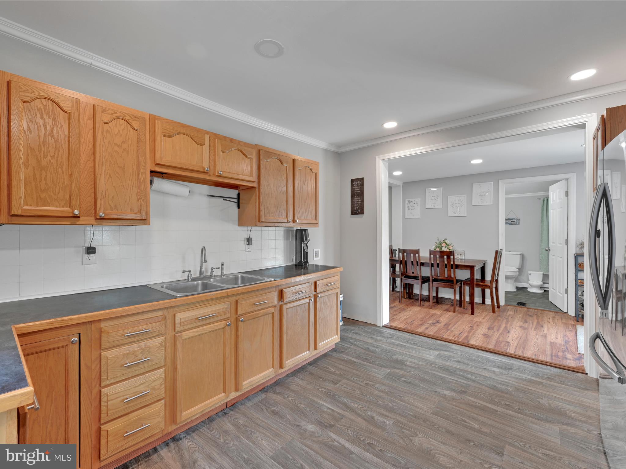 1056 Bellaire Road Elizabethtown, PA 17022 - Photo 12 of 30 a kitchen with stainless steel appliances granite countertop a table chairs sink and cabinets