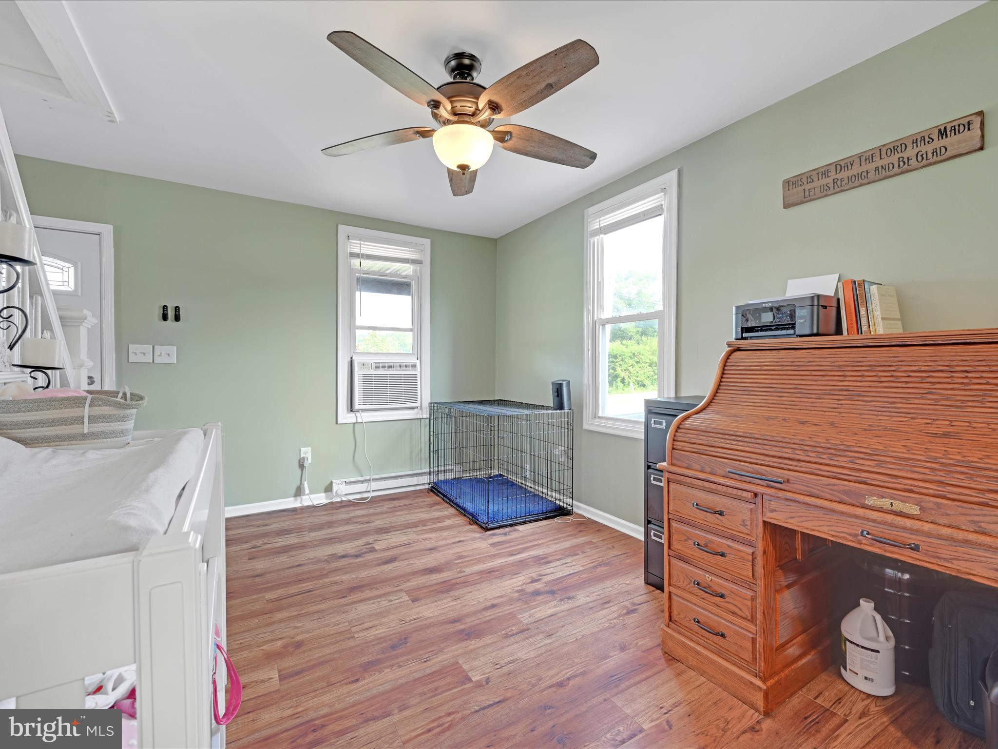 1056 Bellaire Road Elizabethtown, PA 17022 - Photo 4 of 30 a bedroom with a bed and a chandelier