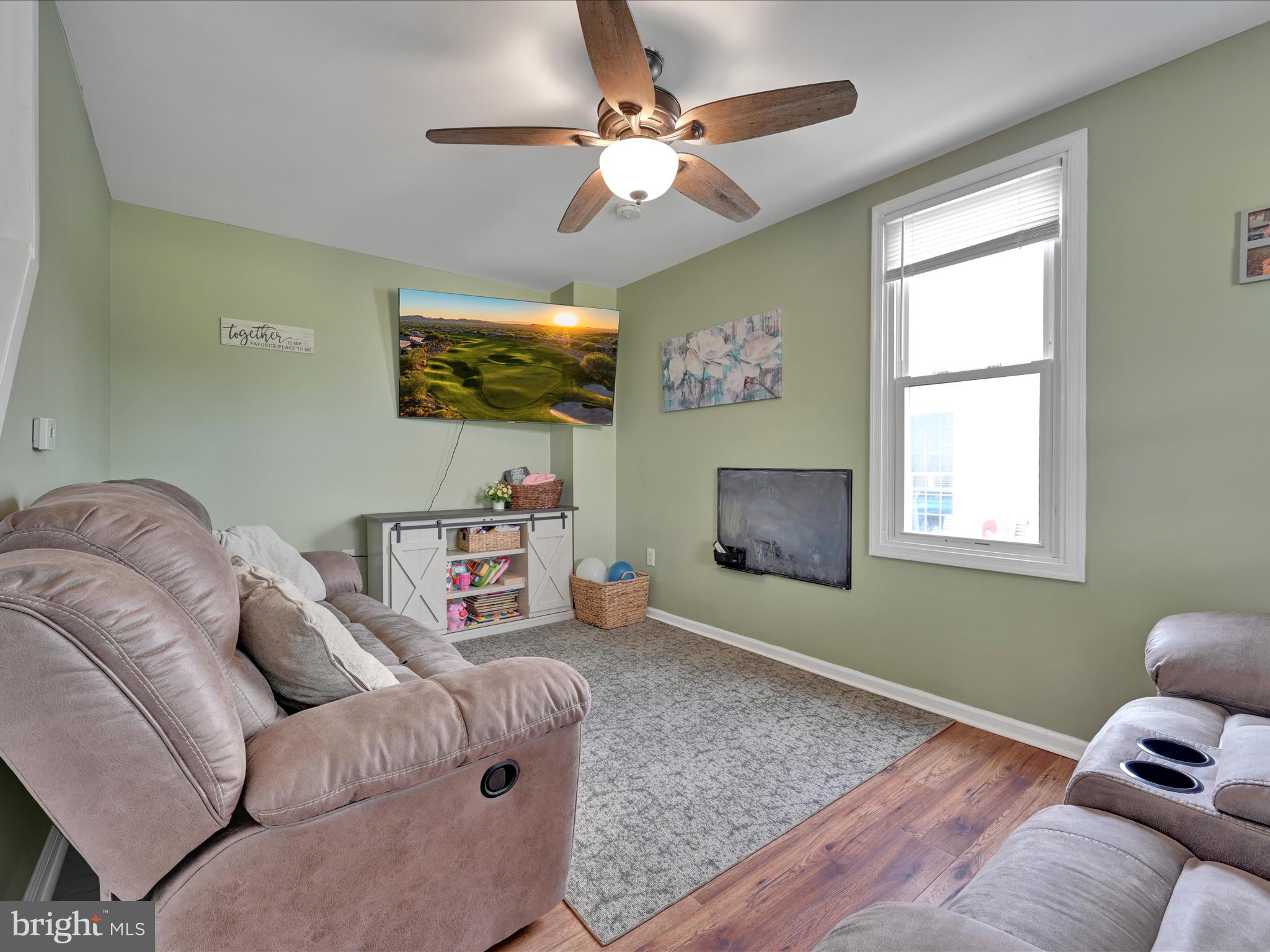 1056 Bellaire Road Elizabethtown, PA 17022 - Photo 6 of 30 a living room with furniture and a flat screen tv