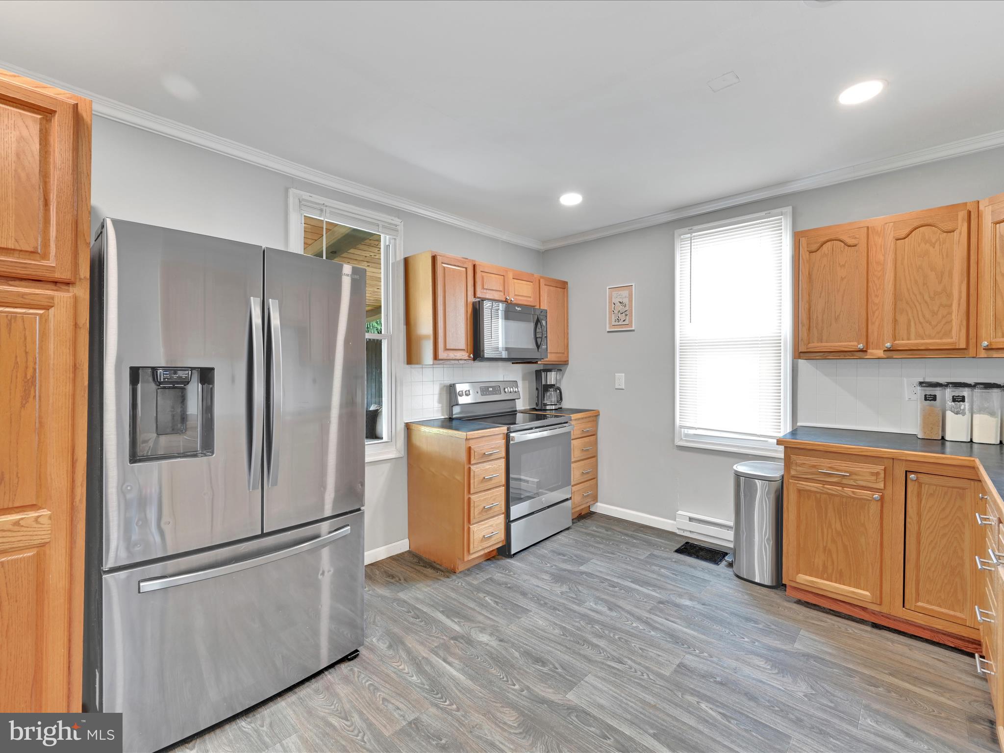 1056 Bellaire Road Elizabethtown, PA 17022 - Photo 10 of 30 a kitchen with stainless steel appliances granite countertop a refrigerator stove and wooden cabinets