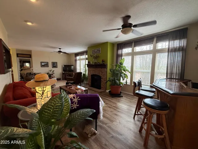 a bedroom with a bed with the view of hallway