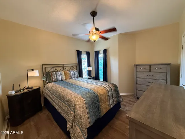 a bedroom with a bed and a mirror