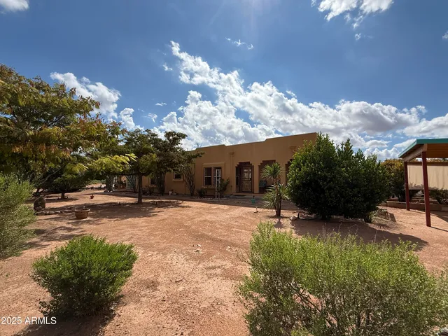 a view of a house with a tree