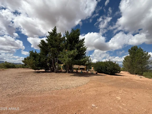 a view of a dry yard covered with snow