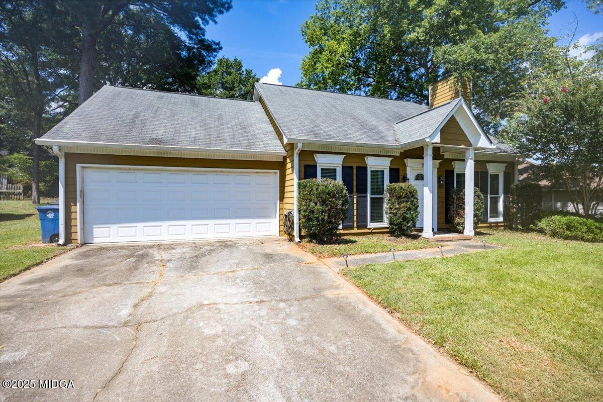 117 Chadwick Drive Macon, GA 31210 - Photo 1 of 32 a front view of a house with a yard and garage