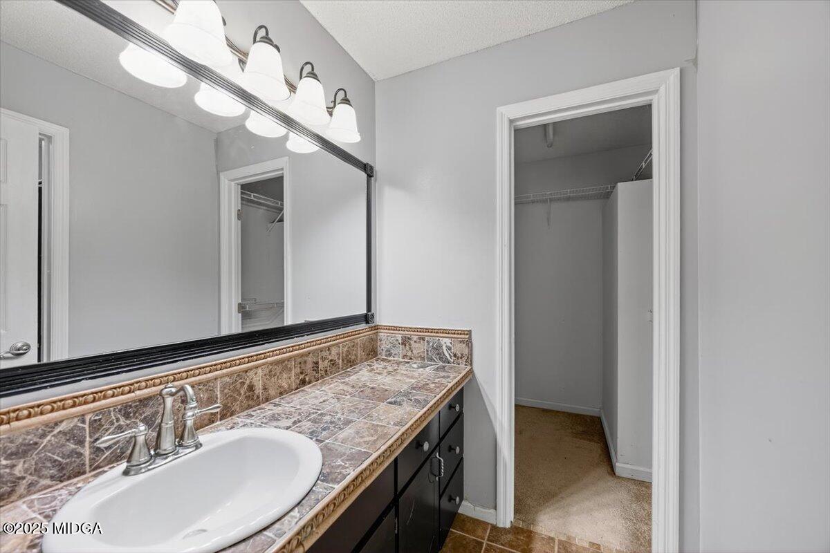 117 Chadwick Drive Macon, GA 31210 - Photo 12 of 32 a bathroom with a sink and a mirror