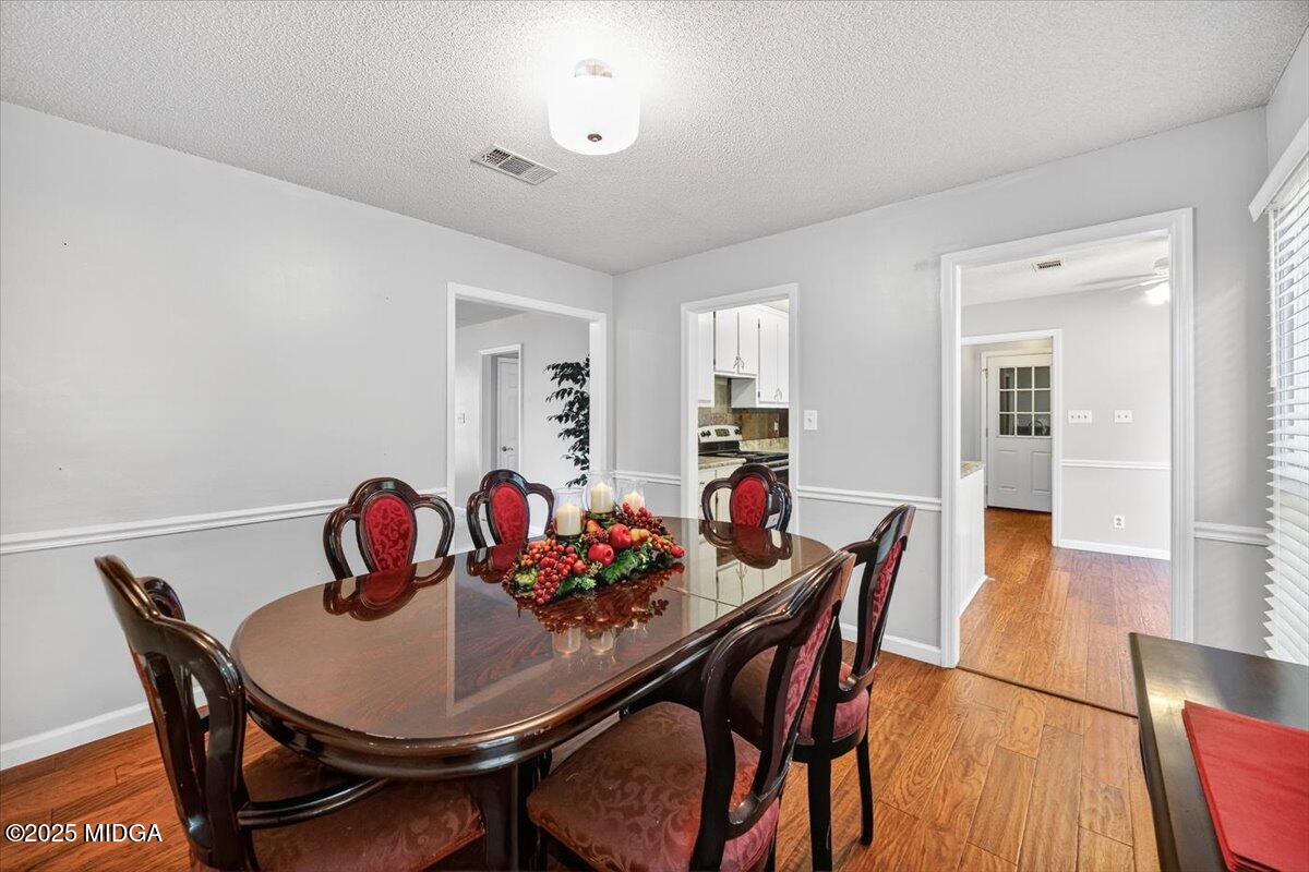 117 Chadwick Drive Macon, GA 31210 - Photo 16 of 32 a view of a dining room with furniture and wooden floor