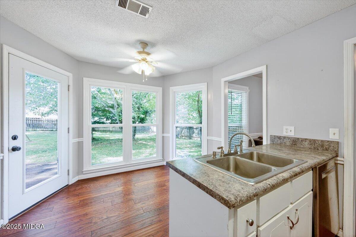 117 Chadwick Drive Macon, GA 31210 - Photo 20 of 32 a kitchen with granite countertop a sink and a window