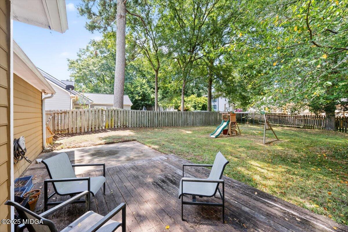 117 Chadwick Drive Macon, GA 31210 - Photo 22 of 32 a view of a chair and table in backyard of the house