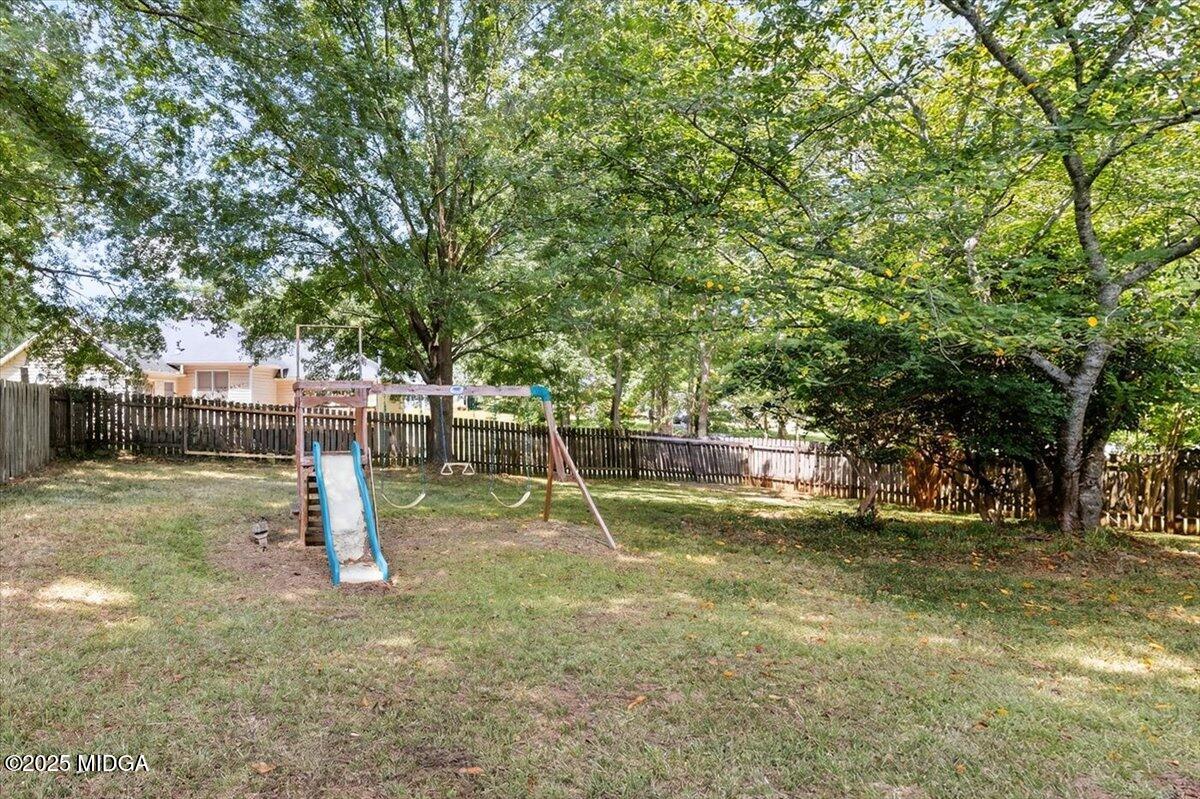 117 Chadwick Drive Macon, GA 31210 - Photo 24 of 32 a view of a backyard with swings