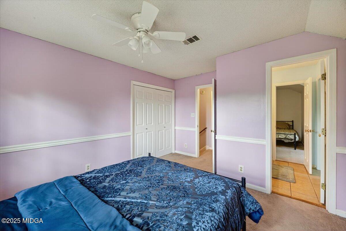 117 Chadwick Drive Macon, GA 31210 - Photo 29 of 32 a bedroom with a bed and a walk in closet