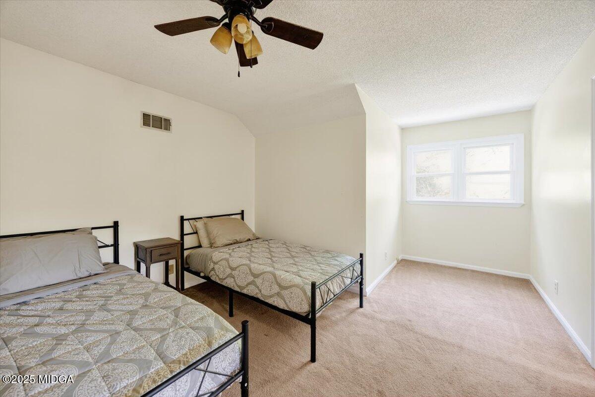117 Chadwick Drive Macon, GA 31210 - Photo 32 of 32 a bedroom with two beds and painted walls