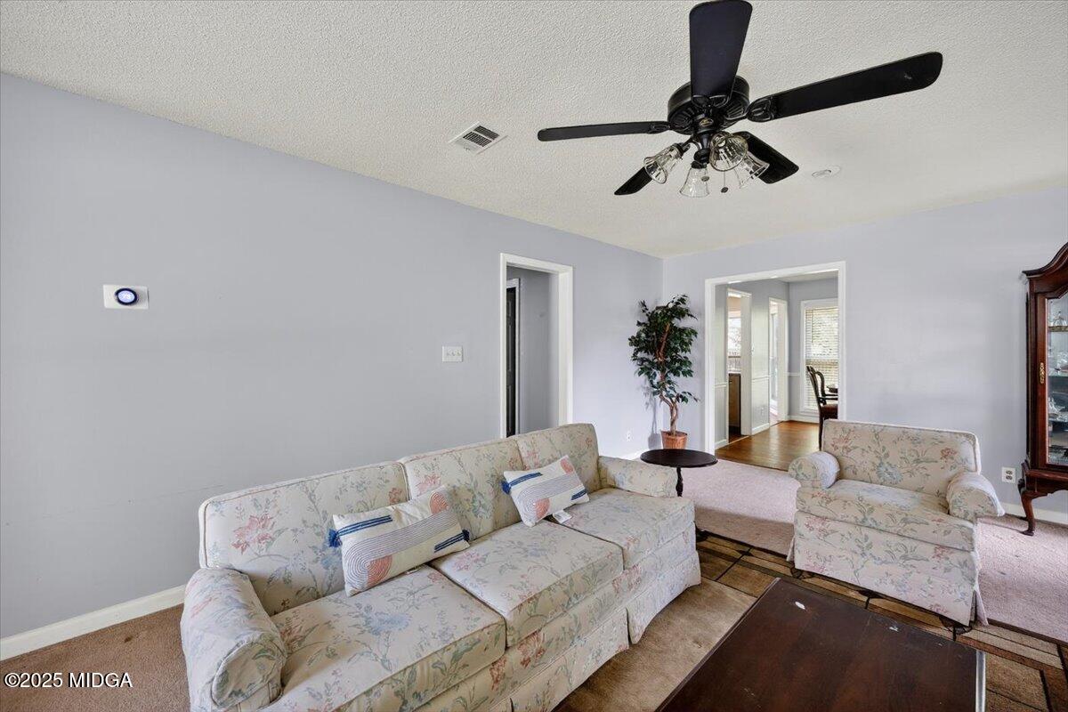 117 Chadwick Drive Macon, GA 31210 - Photo 8 of 32 a living room with furniture and a wooden floor