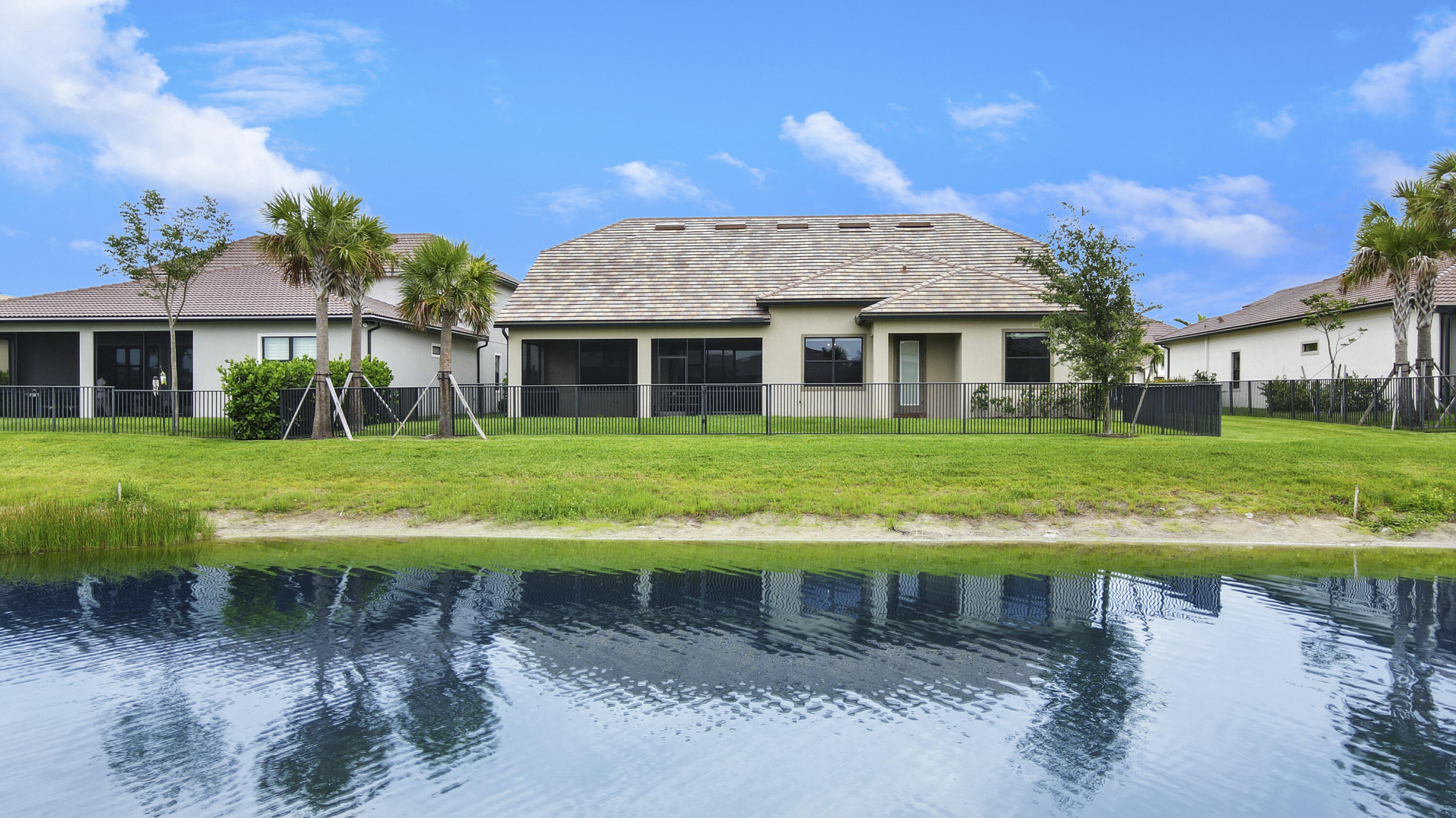 126 Indigo River Point Jupiter, FL 33478 - Photo 38 of 59 Back View of Home on Lake