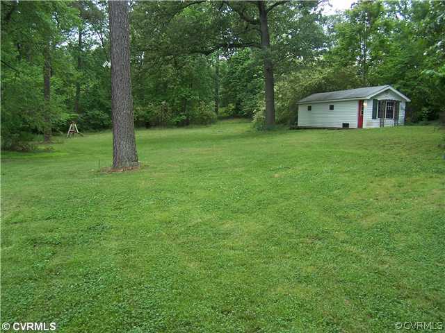 13900 Harrowgate Road Chester, VA 23831 - Photo 2 of 7 a house view with a garden space