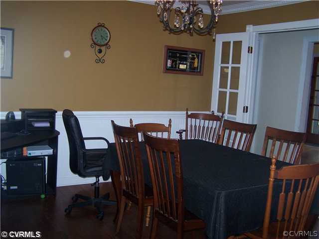 13900 Harrowgate Road Chester, VA 23831 - Photo 3 of 7 a view of a dining room with furniture and chandelier
