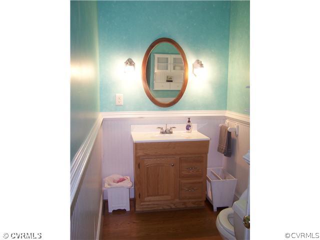 13900 Harrowgate Road Chester, VA 23831 - Photo 5 of 7 a bathroom with a sink and a mirror