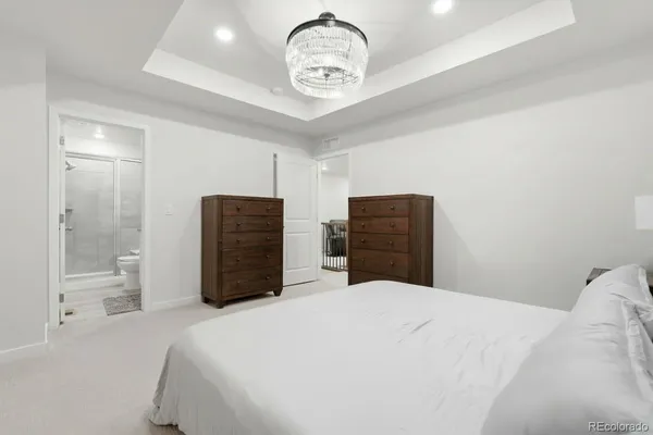 a bedroom with a bed and cabinets