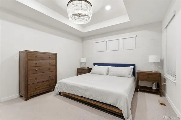 a bedroom with a bed and cabinets