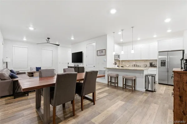 a view of a dining room with furniture and wooden floor