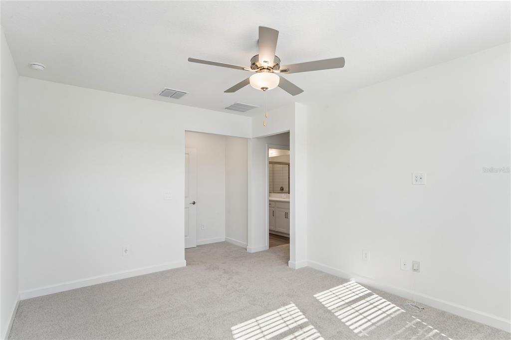 6692 Homebound Way New Port Richey, FL 34653 - Photo 21 of 47 an empty room with closet and fan