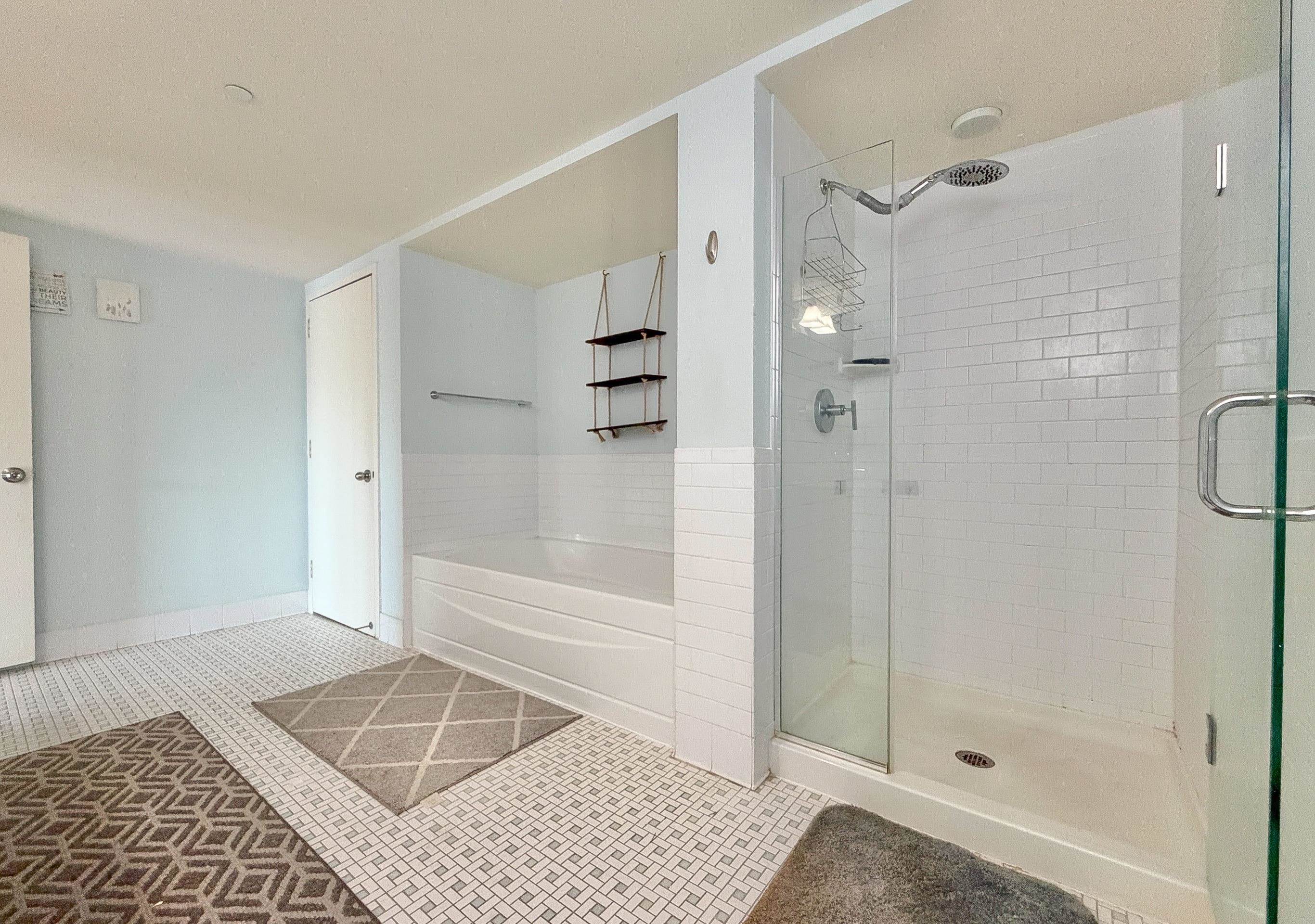 700 Grove Street, Unit 4F Jersey City, NJ 07310 - Photo 23 of 30 a bathroom with a glass shower door