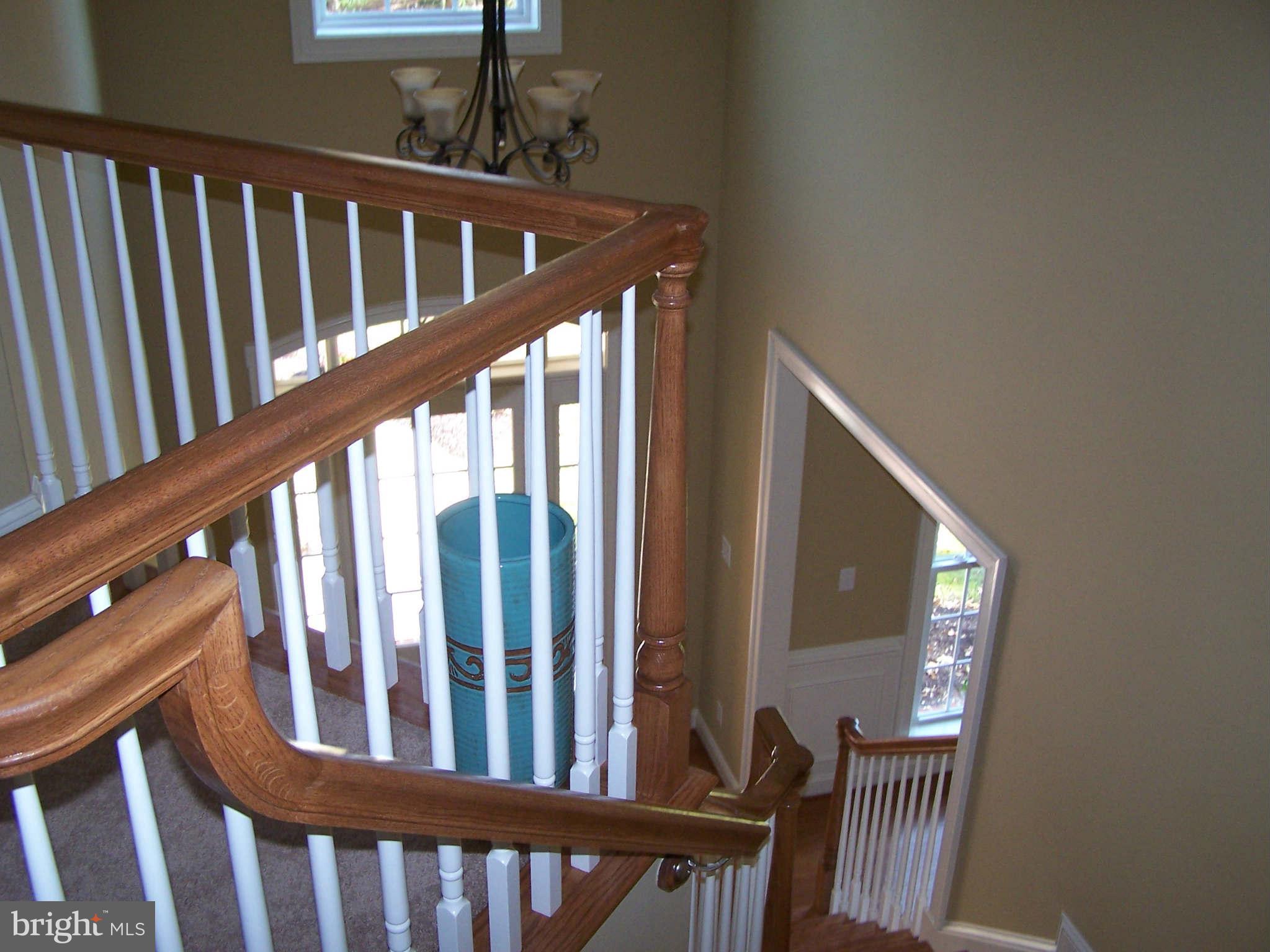2574 Davidsonville Road Gambrills, MD 21054 - Photo 17 of 25 hand stained stairwell