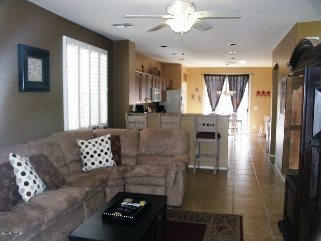 3639 East Warbler Road Gilbert, AZ 85297 - Photo 3 of 18 family room to kitchen