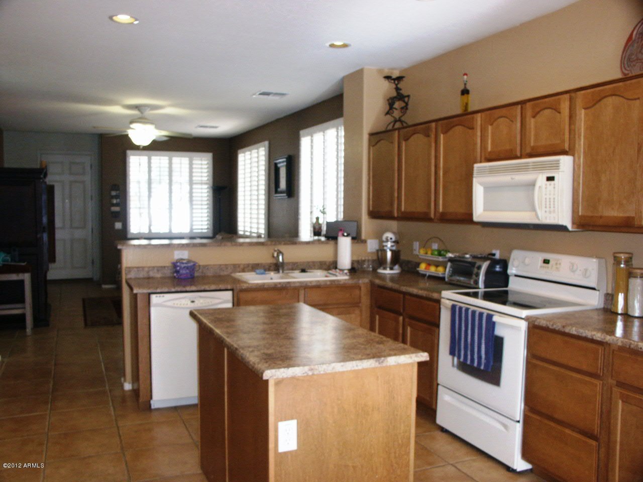 3639 East Warbler Road Gilbert, AZ 85297 - Photo 8 of 18 kitchen to family room