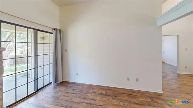 wooden floor and windows in an empty room