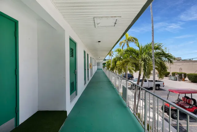 a living room with furniture and a glass door