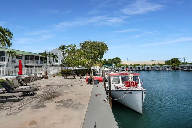 a terrace with outdoor seating and city view