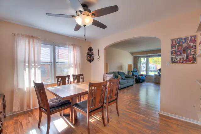 a reading room with furniture a bookshelf and a window
