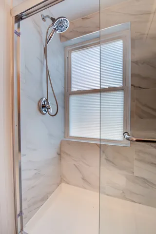 a room with pool table and a fireplace