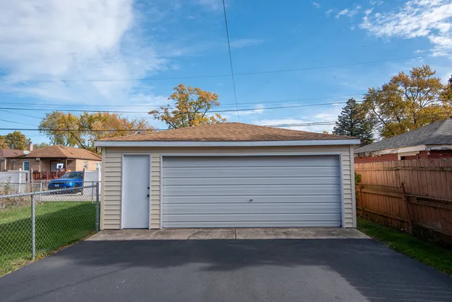 a side view of a house with a garage