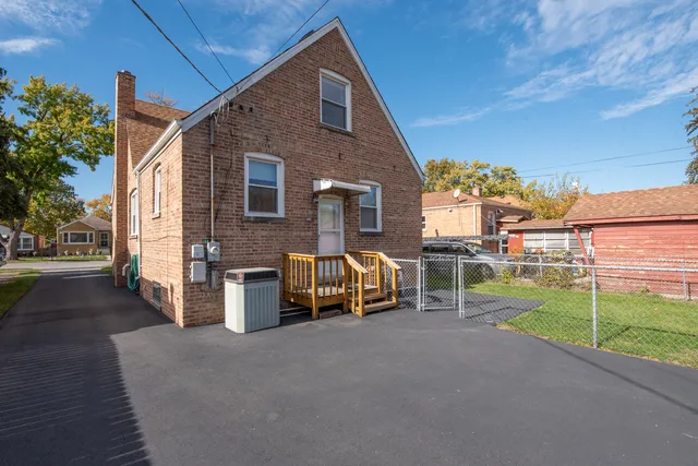 a view of house with outdoor space and seating area
