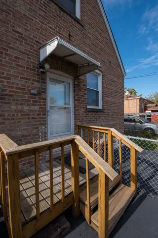 a view of wooden house with a street