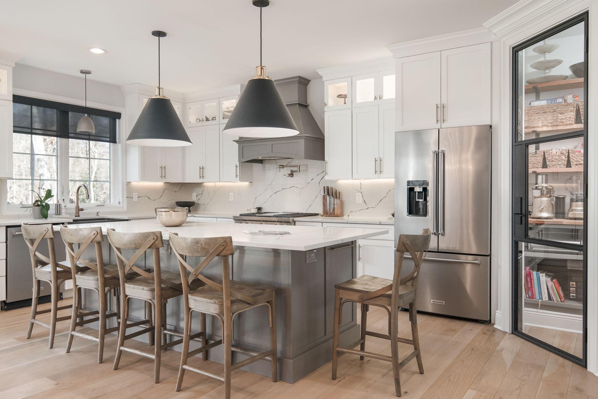 716 Cheese Spring Road New Canaan, CT 06840 - Photo 13 of 56 a kitchen with stainless steel appliances granite countertop a refrigerator a sink a stove a dining table and chairs