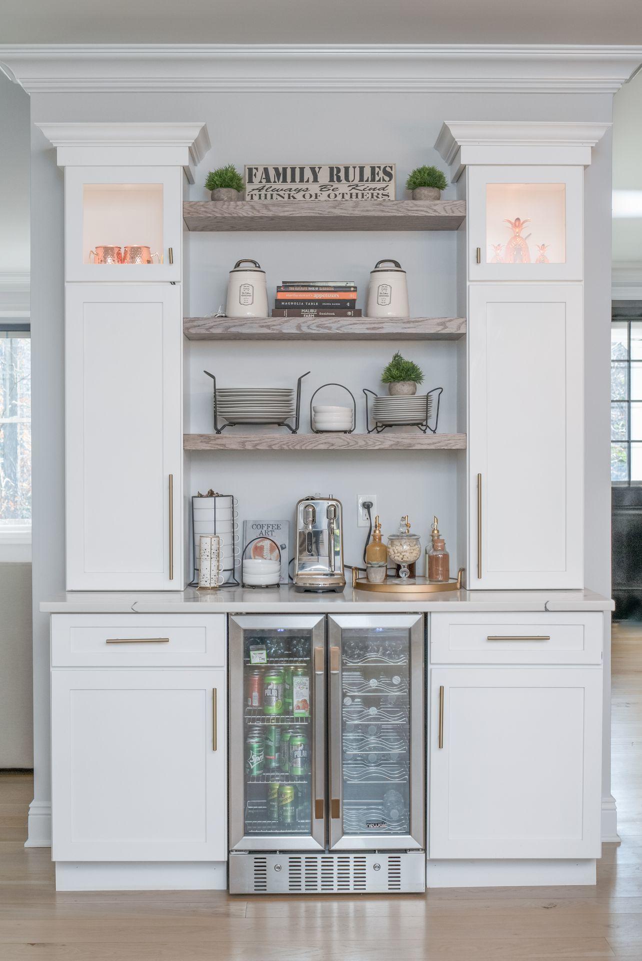 716 Cheese Spring Road New Canaan, CT 06840 - Photo 16 of 56 a kitchen with white cabinets and wooden floor