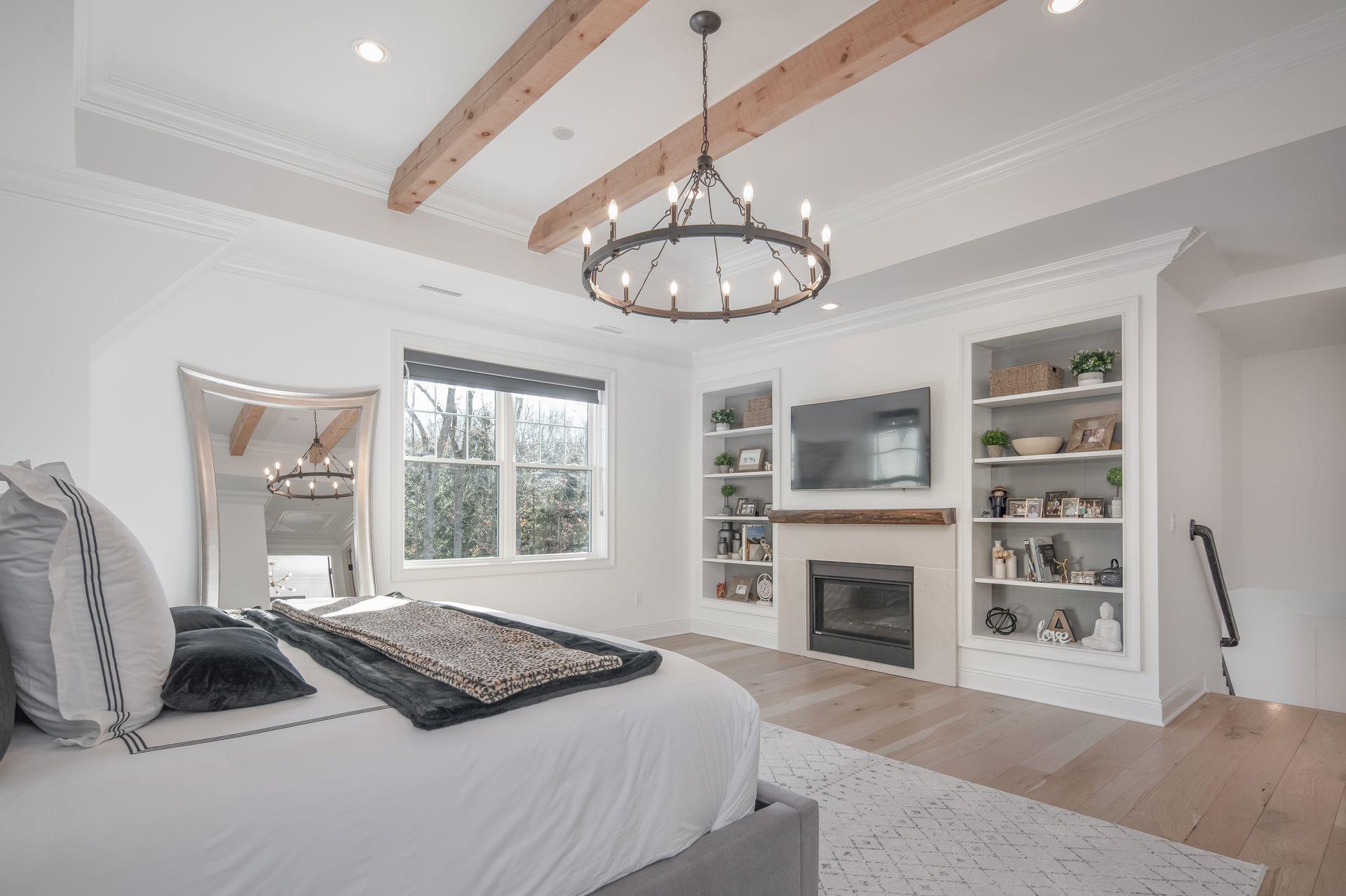 716 Cheese Spring Road New Canaan, CT 06840 - Photo 23 of 56 a bedroom with a bed and a fireplace