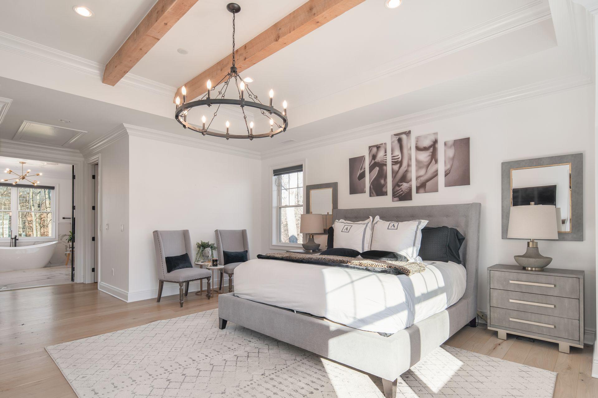 716 Cheese Spring Road New Canaan, CT 06840 - Photo 30 of 56 a bedroom with a bed mirror and furniture